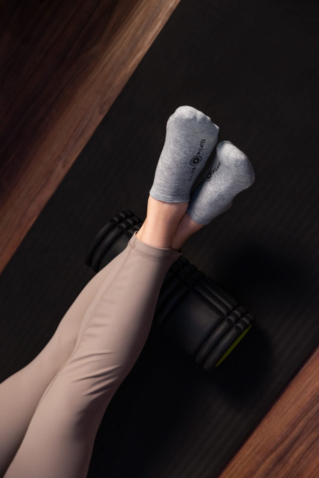 Member using a foam roller during Restore class